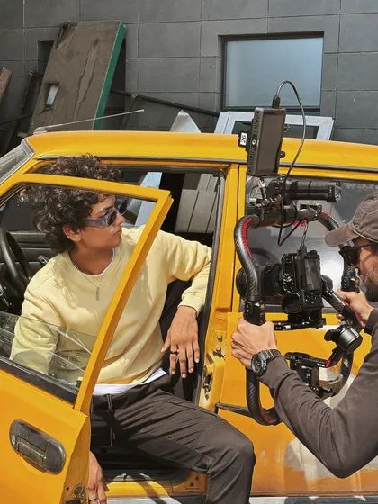 Behind the scenes in Baku, directing a shot inside a vintage taxi. Location scouting often leads us to interesting props like this.