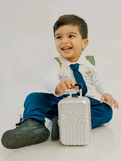Ready for takeoff into a world of imagination! My themed sessions are all about bringing your child's dreams to life. With a wardrobe full of costumes like this tiny pilot's uniform, we can create a playful adventure they'll never forget.