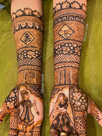 I love bringing a couple's story to life. This full bridal mehendi features custom portraits of the bride and groom, along with religious symbols like the Ganesha, making it deeply personal and unique to their wedding.