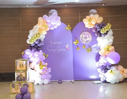 A beautiful butterfly-themed "Welcome Baby" party for Saanvi Gautam. The purple backdrops and gold butterfly accents create a sophisticated and sweet look.