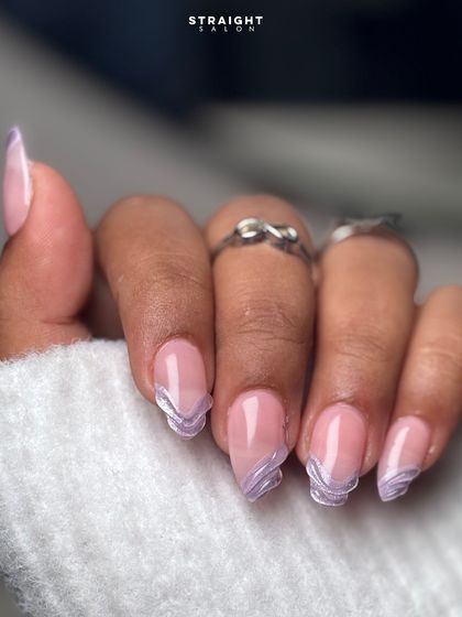 A delicate and dreamy design featuring a sheer pink base with purple marble-effect tips and a subtle dusting of glitter for a touch of sparkle.