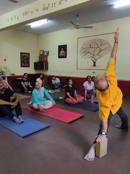 Teaching Trikonasana in a workshop.