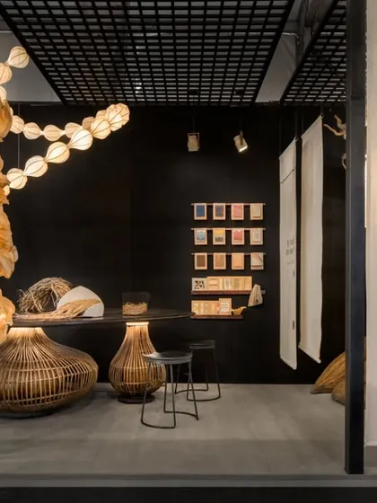 A wide view of one section of the exhibition booth. We used a dark, neutral backdrop to make the illuminated pieces pop. The layout was carefully planned to balance large statement installations with smaller product displays, ensuring a dynamic visual experience from every angle.
