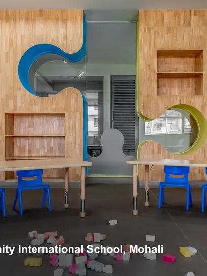 A classroom at Amity International School, Mohali, with playful, puzzle-piece cutouts in the walls. This design embraces flexibility and creativity, creating a responsive and enduring learning space.