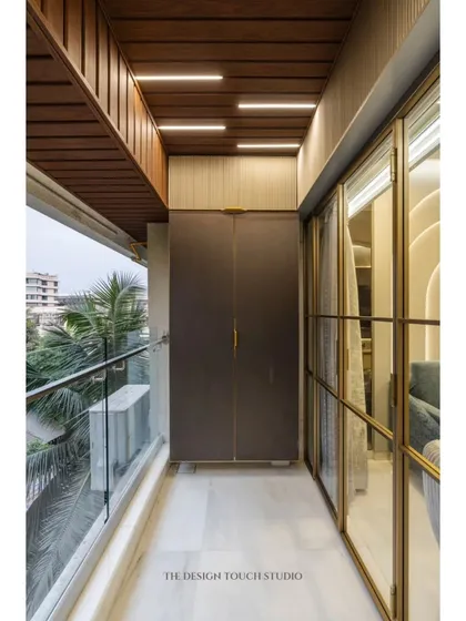 We believe every part of a home deserves great design, including the ceiling. This balcony features a stylish wooden-paneled ceiling with integrated linear lighting, adding warmth and a modern touch.