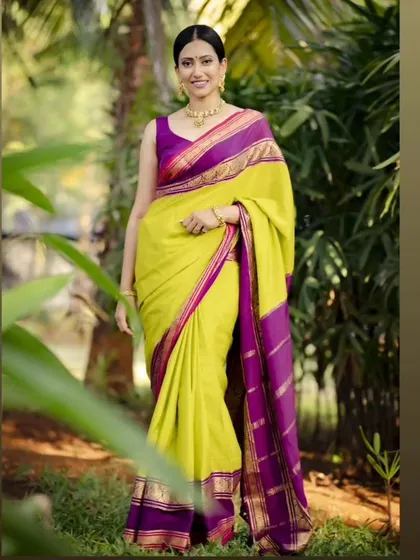 A beautiful shot of a model wearing my pure Mysore crepe saree. The lime green and purple contrast is a classic combination that always looks elegant.