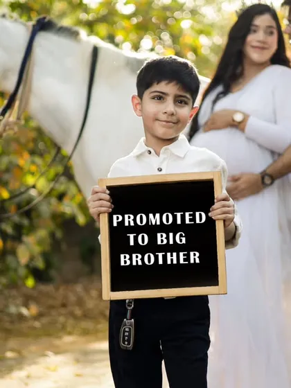 What a beautiful way to share the news. Including the whole family, especially the soon-to-be big brother, makes the memory so much sweeter. These are the moments that make your family story complete.