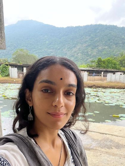 A photo from my visit to the Isha Yoga Center, with the serene mountains and lotus pond in the background. The entire experience was beyond imagination and left my heart full.