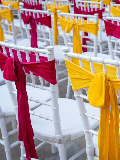 It's all in the details. For this Haldi, I used bright yellow and magenta fabric to tie the guest chairs, adding a simple but effective pop of color that ties the whole theme together.