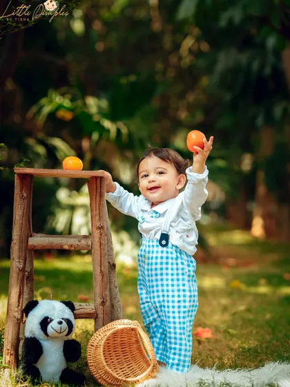 A playful moment during an outdoor picnic session with some furry friends. The natural light and setting are perfect for candid shots.