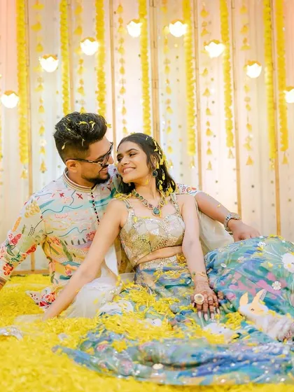 The 'phoolon ki haldi' is a carnival of joy. I love capturing the vibrant colors, the laughter, and the sheer fun of being showered in flowers and love by your favorite people.