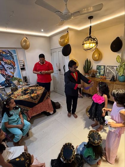 Performing for an intimate group of kids at a house party is always special. I make sure every child feels like they are part of the show, gathering them close for some up close magic.