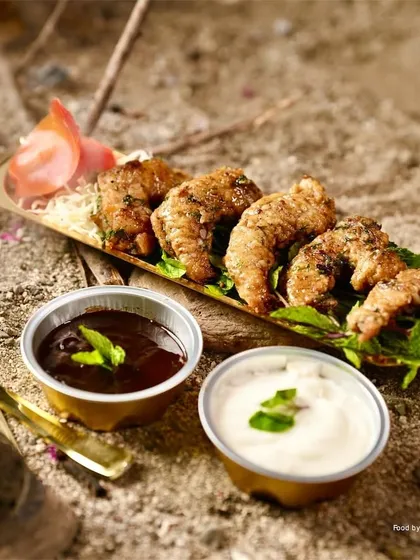 Juicy Butter Garlic Prawns, perfectly cooked and served with two dipping sauces, a tangy tamarind and a creamy mayonnaise. A seafood lover's delight.
