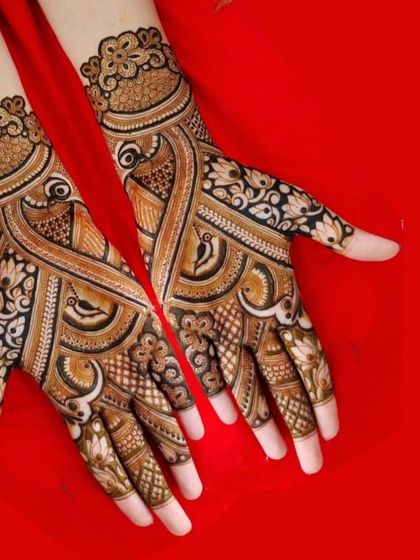 A bold and striking design with prominent peacock motifs and heavy use of dark, filled-in areas for a dramatic effect.