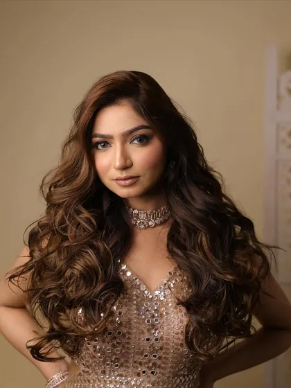 A close-up of the beautiful, voluminous curls, a popular choice for reception and cocktail parties.