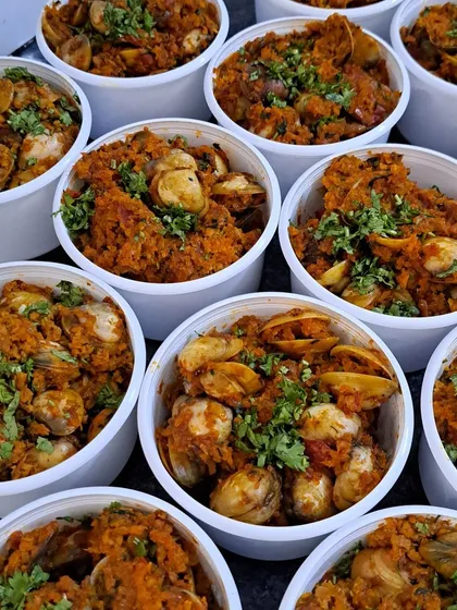 These are fresh cockles, or 'khube', cooked in a delicious Goan sukka masala. This dish is a Saturday special that often sells out quickly, a testament to its irresistible flavor.