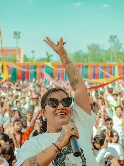 Leading a massive crowd at a Holi festival in Ranchi. I love the energy of outdoor events, connecting with thousands of people through a mix of high-energy Bollywood and Punjabi beats.
