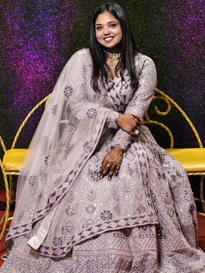 Another look at our client in the elegant lavender lehenga. The full sleeves and detailed embroidery make it a great choice for cooler evening functions.