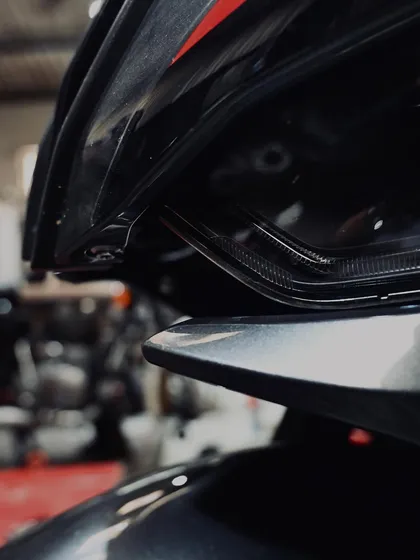 The aggressive, modern headlight design of the BMW S1000RR.