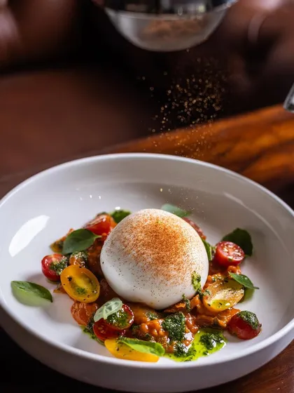 My Burrata Salad is as refreshing as it looks, squashing the misconception that salads are boring. Here it is getting a final dusting of spice.
