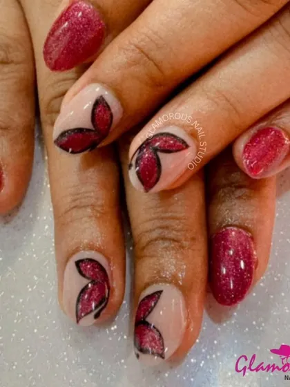 A bold combination of shimmery red nails and sheer accent nails with hand-painted red and black butterfly wing details.