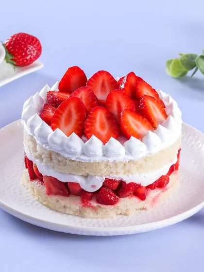 My Fresh Strawberry Vanilla cake is light, fresh, and delicious. It's made with layers of vanilla sponge, whipped cream, and packed with fresh strawberries, celebrating the best flavors of the season.