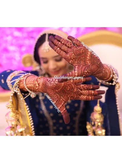 A beautiful, artistic shot of a bride's mehndi stain. The deep color looks incredible in professional photos.