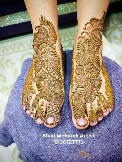 I offer a variety of styles for bridal feet mehandi. This design features a dense, paisley and peacock-inspired pattern that covers the entire top of the foot for a truly regal look.