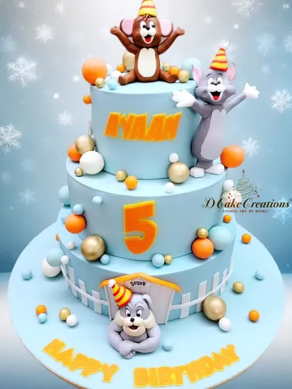 A fun and nostalgic three-tier Tom & Jerry cake for Ayaan's 5th birthday. The design captures the playful chase between the iconic cartoon duo.