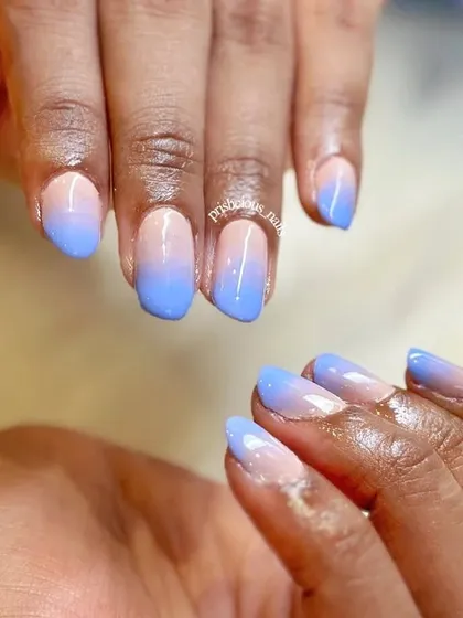Having ombré nails is a choice, and it's a good one. This simple and clean set features a baby blue to nude gradient on natural nails.