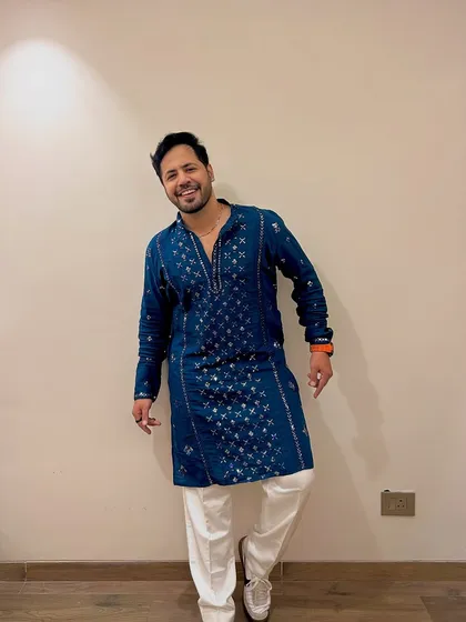 Rocking a stylish blue embroidered kurta. I have a look for every theme and every function.