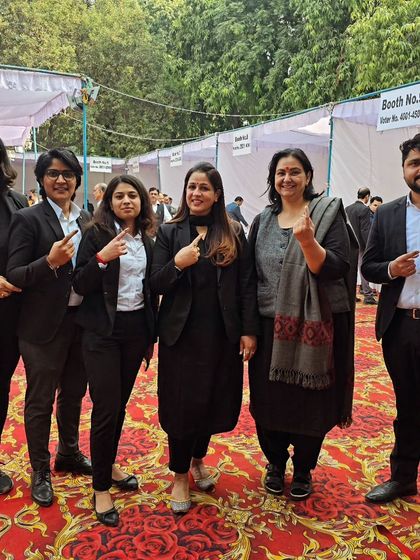 Proudly showing our inked fingers after voting. We believe in active participation in our professional community.