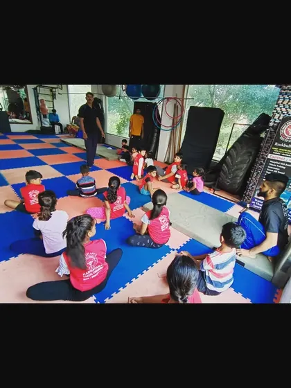 A typical scene from one of my kids' classes. We always start with a group warm-up and discussion before getting into the day's drills.