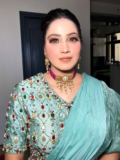 A frontal view, her makeup and jewelry creating a beautiful, cohesive look.