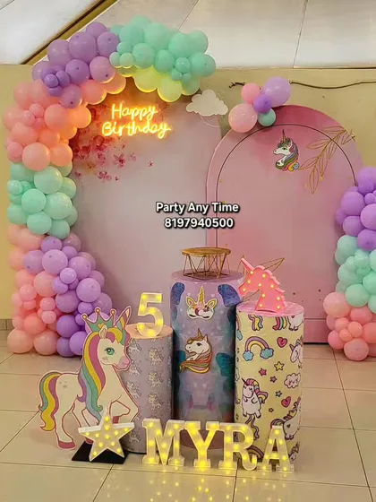 A unicorn theme is always a favorite for kids. I can create a complete magical world with pastel rainbow balloon arches, unicorn cutouts, themed pedestals, and light-up letters for the birthday girl's name.