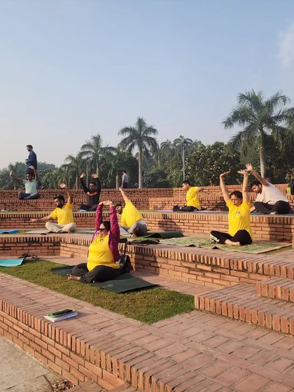 Students practicing yoga in the beautiful amphitheater-style steps at the park during our picnic.