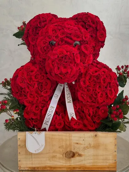 I create more than just bouquets; I sculpt with flowers. This is Valentino, my floral teddy bear, meticulously crafted from hundreds of fresh red roses. It's a unique and romantic gesture for proposals, anniversaries, or a grand declaration of love.