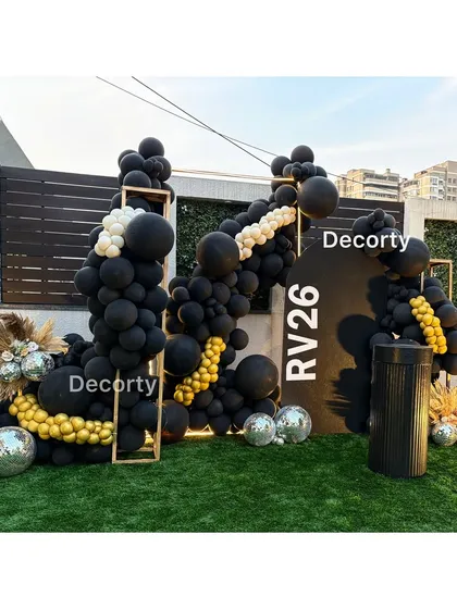 A stylish and modern 'Disco Night' birthday party backdrop for an adult celebration. The design features a bold black balloon arrangement with gold accents and shimmering disco balls for a chic party atmosphere.