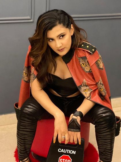 Another shot of the amazing Aastha Gill, rocking the edgy side-braid look we created for her.