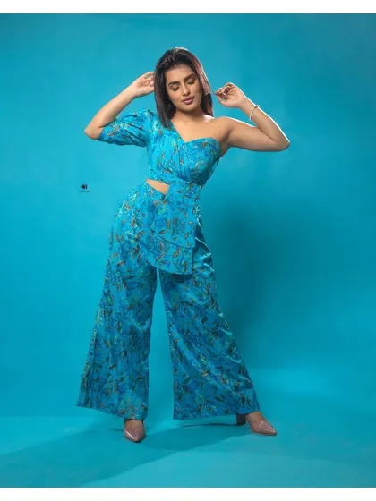 For a modern and chic look, I offer contemporary pieces like this blue floral one-shoulder co-ord set. It's a stylish and comfortable option for parties, birthdays, or a unique pre-wedding event.