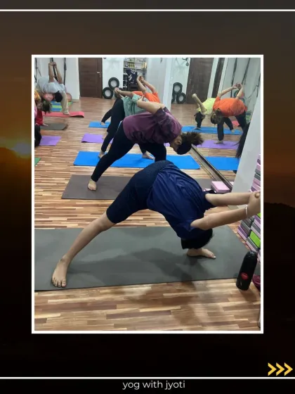 A class practicing various deep stretches and balancing poses, including a wall-supported twisted forward bend.