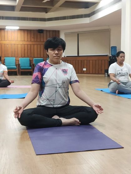 A student from our international training program deep in meditation. We cultivate an atmosphere of serenity and focus, allowing for profound personal transformation.
