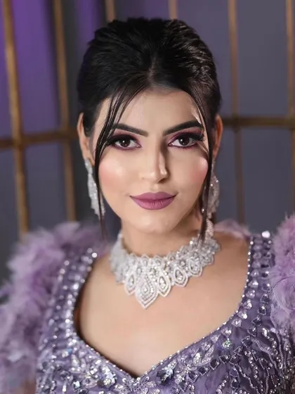 A confident and glamorous shot of the model, showcasing the complete cocktail look that is perfect for a reception or sangeet.