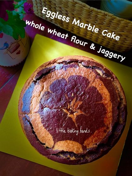 An eggless marble cake made with whole wheat flour and jaggery, baked for a school birthday celebration. The classic swirl is always a hit with kids.
