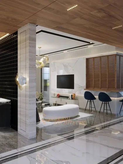 This view shows a lounge area with a bar, TV, and comfortable seating, all unified by a sophisticated material palette of marble and wood.