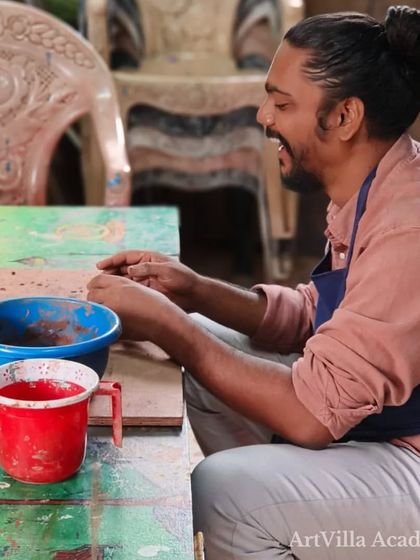 A student enjoys the process of mixing and preparing clay. We believe that every step of the pottery journey, from prep to final piece, is a part of the art itself.