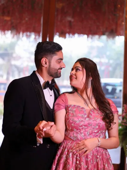 A sweet, candid moment between the couple. The bride's makeup is subtle and radiant, ensuring she looks and feels her best.