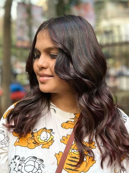 Our Cherry Choco balayage blend. This look combines deep chocolate tones with hints of cherry red for a subtle yet playful effect.