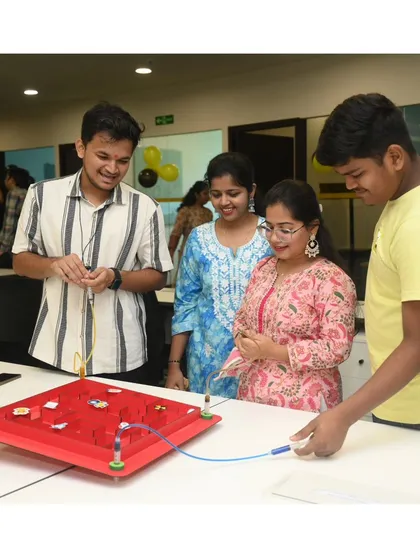 Who said the kids get to have all the fun? Our interactive game zones, like this steady-hand maze, often attract adults who are eager to test their skills, adding another layer of engagement and friendly competition to your event.