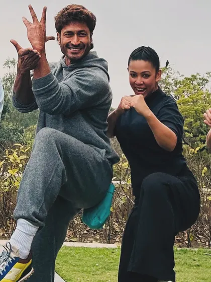 A fun, synchronized martial arts pose with my inspiration. It's all about sharing the energy and passion for fitness.